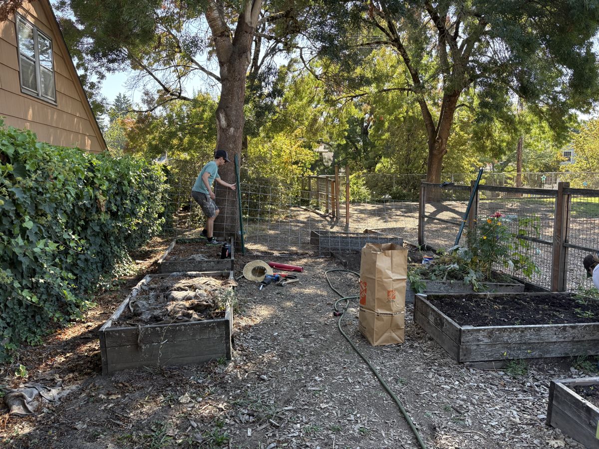 Josh working on the garden's fence extension